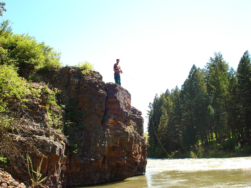 Nate fishing off a ledge